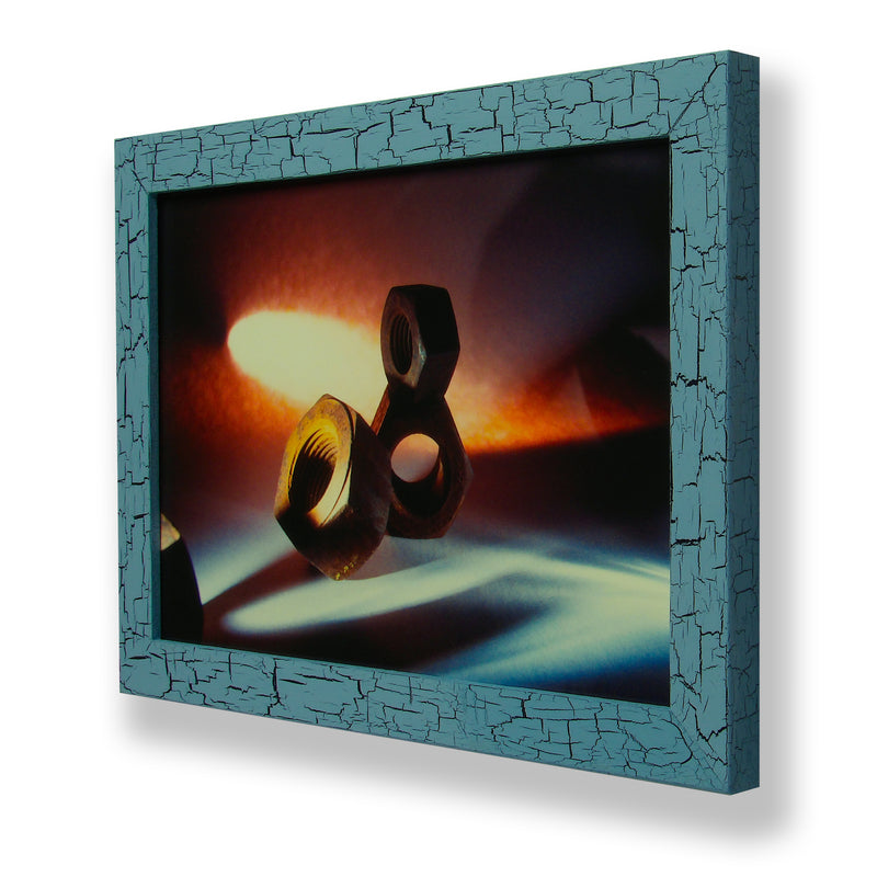 Framed abstract close-up photograph of rusty machine nuts. Framed with a one of a kind hand painted picture frame.