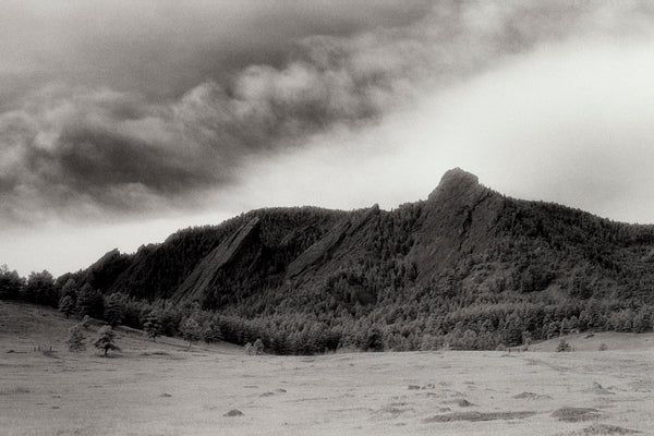 Art Print - An Infrared black & white photograph of the Flatirons rock formation.