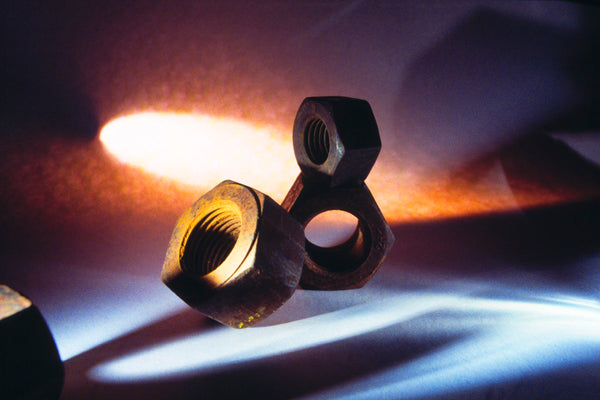 Art Print - An abstract closeup photograph of rusty machine nuts.