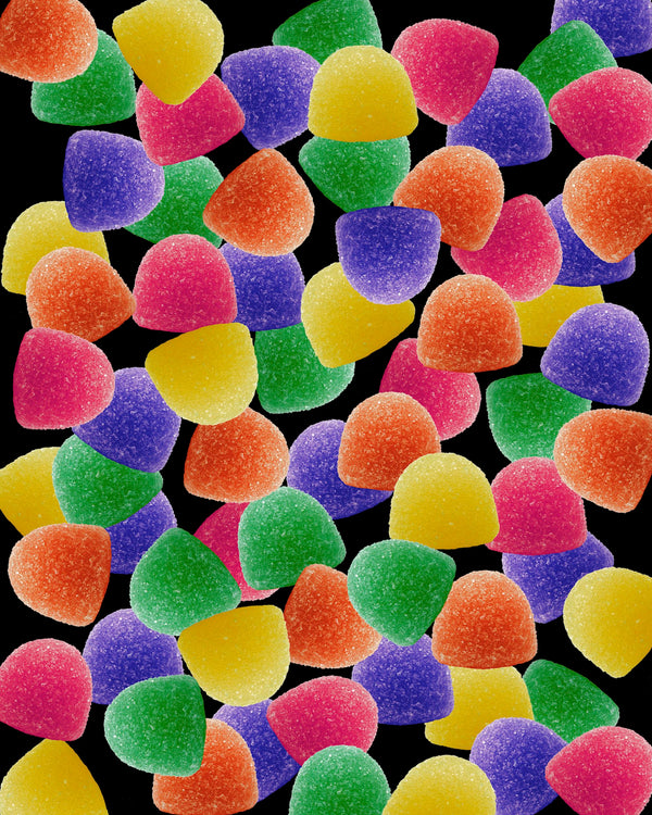 Art Print - A photograph of gumdrops on a black background.