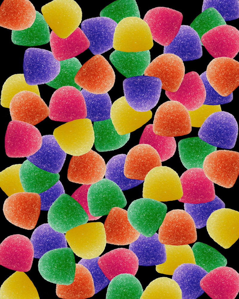 Art Print - A photograph of gumdrops on a black background.