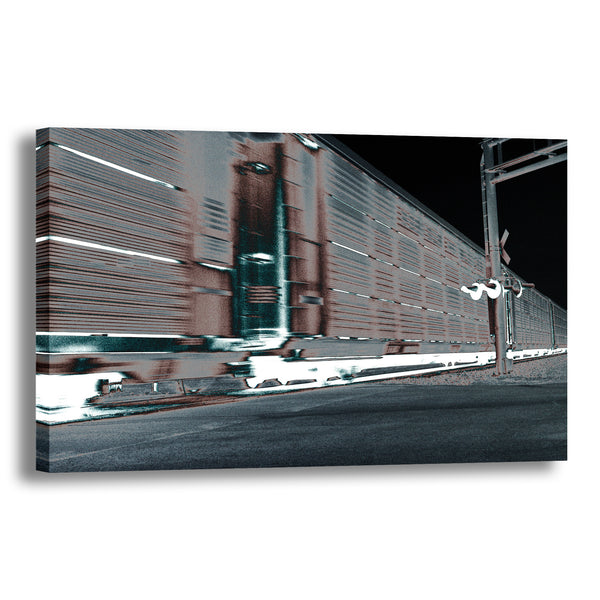 Canvas Art Print -  A blurred motion abstract photograph of a train at a railroad crossing.