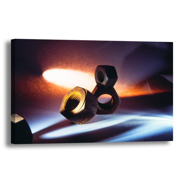 Canvas Art Print - An abstract close-up photograph of rusty machine nuts.