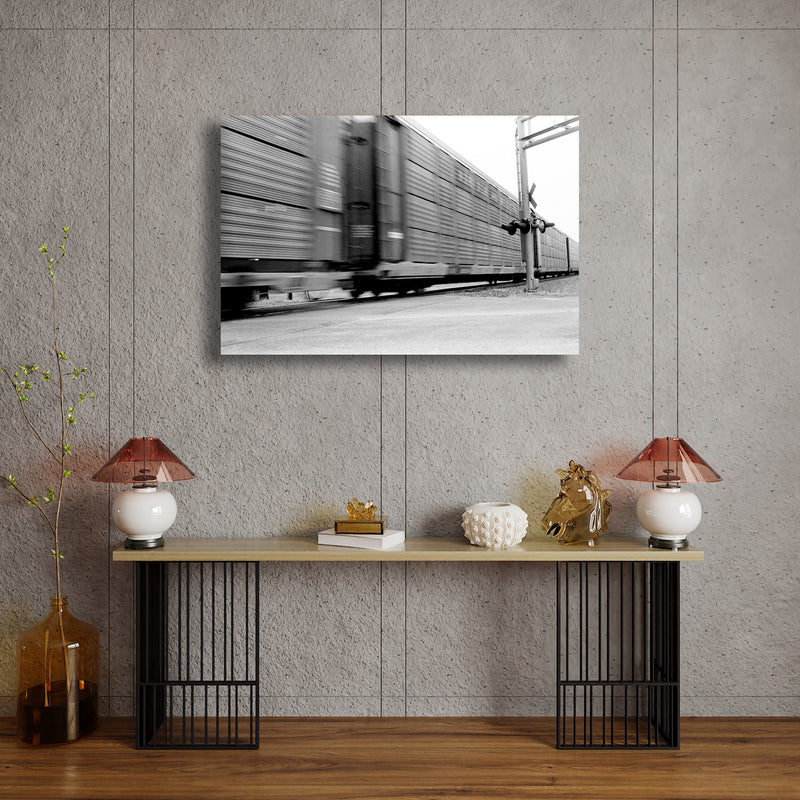 Metal Art Print - A blurred motion photograph of a train at a railroad crossing.